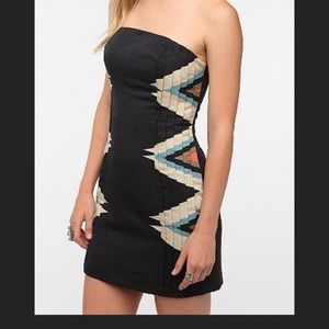 Pleated strapless mini dress, dark navy, tribal pattern to sides of dress.